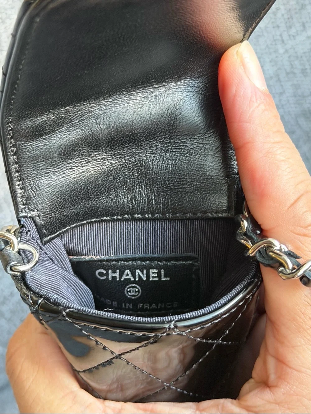 CHANEL Black Patent Leather Quilted Phone Case with Silver Hardware